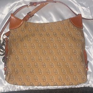 Dooney and bourke crossbody purse. Pre owned. Brown in color